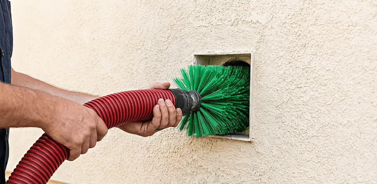Air duct cleaning brush removing debris from a vent opening in Worcester, MA