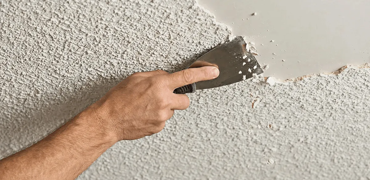 Popcorn ceiling removal scraping off textured ceiling finish in Worcester, MA