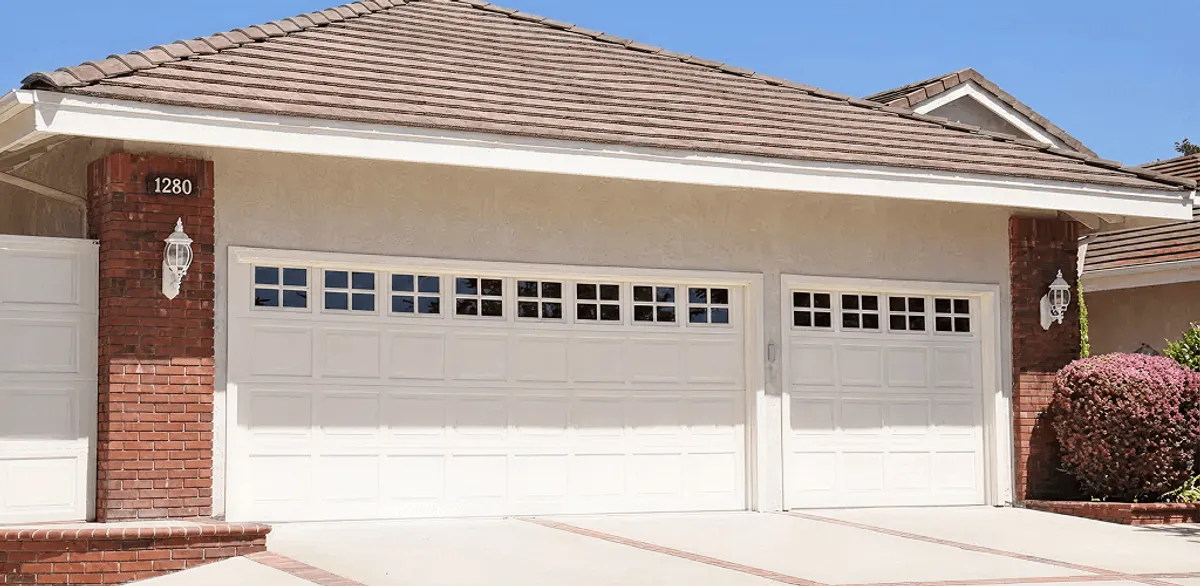 Residential garage door repair service for a double garage door in Worcester, MA